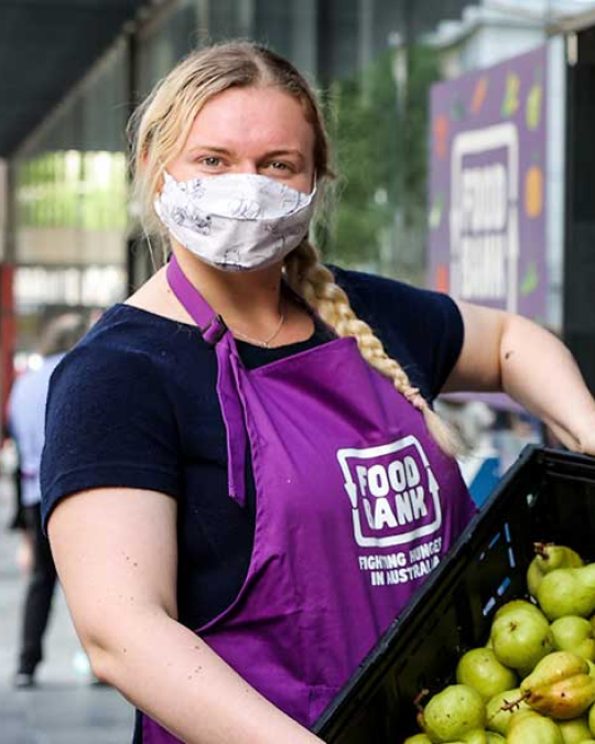 Woman volunteering for Foodbank in Sydney