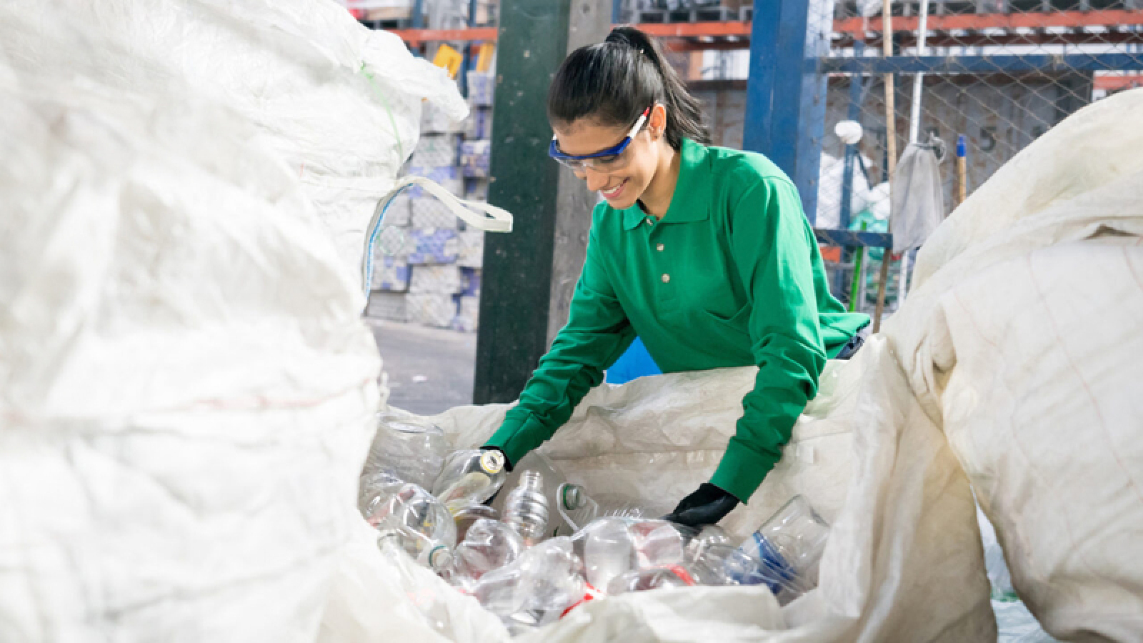 Woman from Wanless sorting through recycling